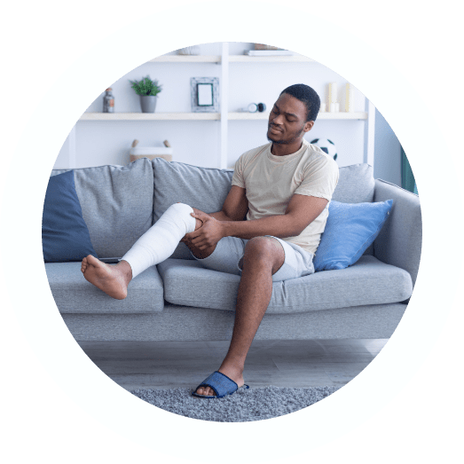 Man on couch unable to participate in activities after an accident
