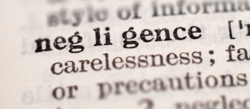Dictionary definition of word negligence, selective focus. Concept of what are the four types of negligence
