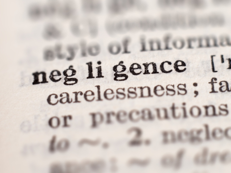 Dictionary definition of word negligence, selective focus. Concept of what are the four types of negligence