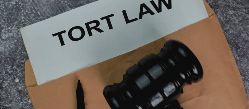 Tort Law text write on a paperwork and gavel isolated on office desk. Concept of How Will Florida Tort Reform Bill 837 Affect My Injury Case