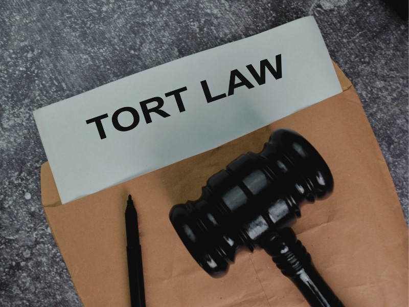 Tort Law text write on a paperwork and gavel isolated on office desk. Concept of How Will Florida Tort Reform Bill 837 Affect My Injury Case