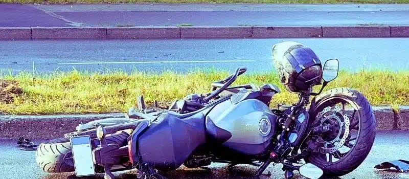 damaged motorbike on the city road at the scene of an accident. motorcycle accidents in florida