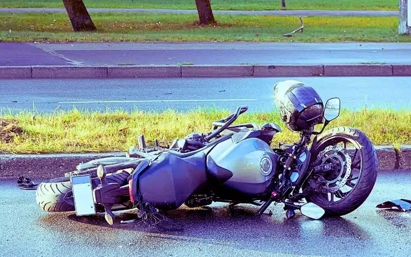 damaged motorbike on the city road at the scene of an accident. motorcycle accidents in florida