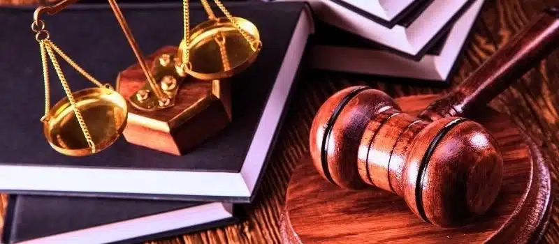 Balance scale on top of the books and gavel on the side. Suboxone lawsuits