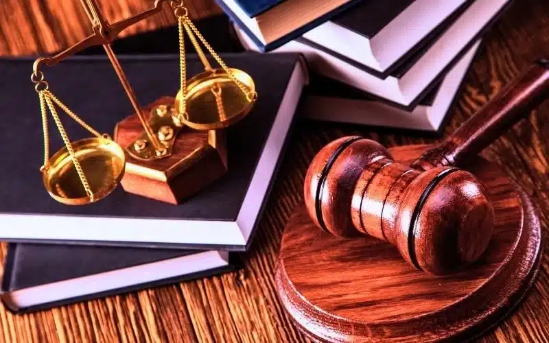 Balance scale on top of the books and gavel on the side. Suboxone lawsuits