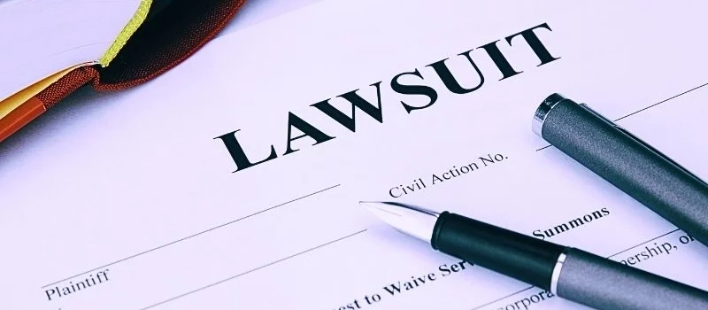 lawsuit form with filler and book. Suboxone lawsuit.