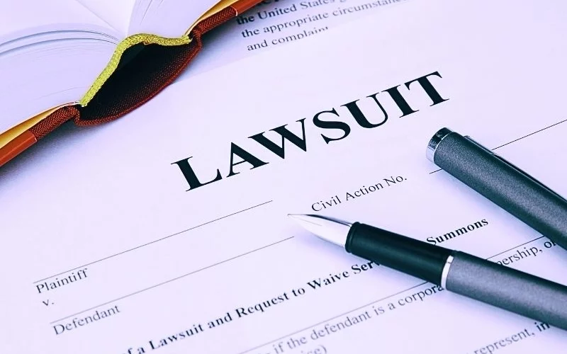 lawsuit form with filler and book. Suboxone lawsuit.