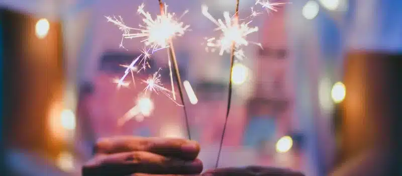 Teenage girl holding a fireworks.