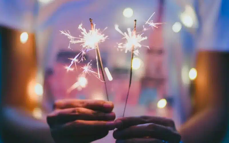 Teenage girl holding a fireworks.