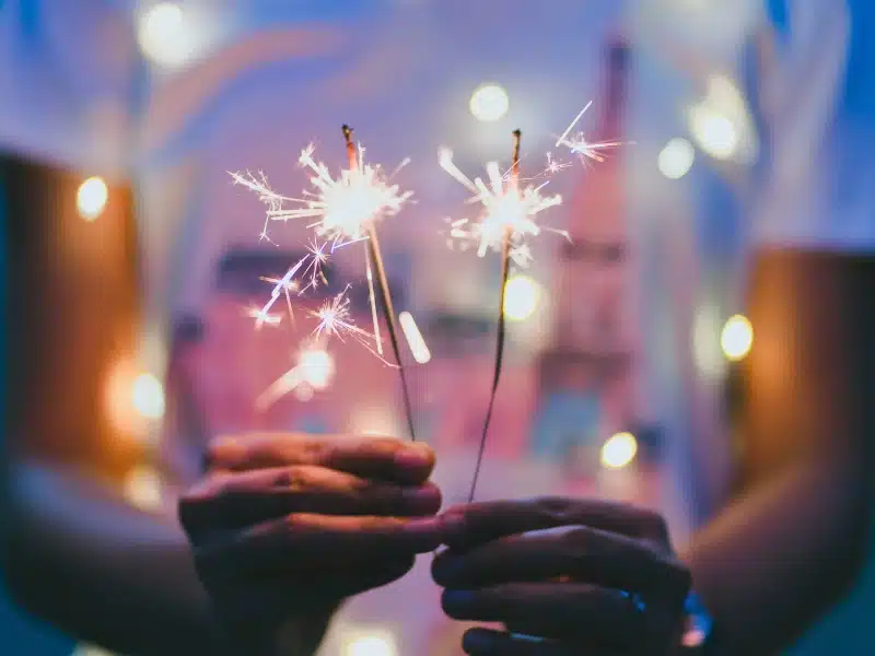 Teenage girl holding a fireworks.