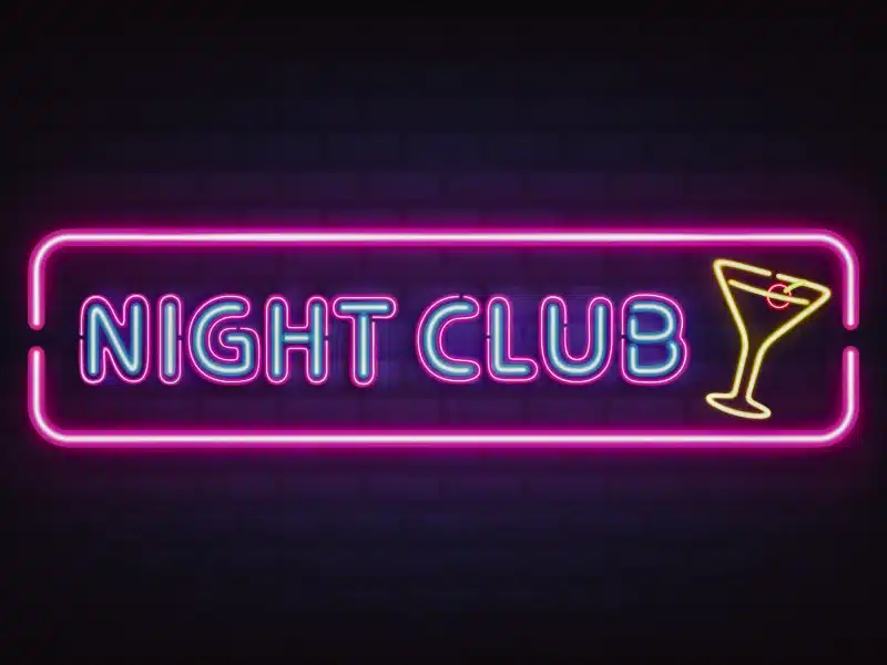 Night club, cocktail bar bright neon retro signboard. Dram Shop Laws