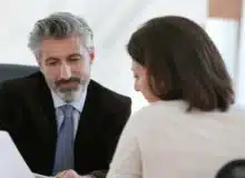 Male lawyer talking to a woman patient.