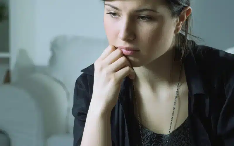 Frustrated woman wearing black dress.