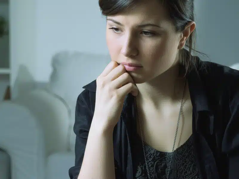 Frustrated woman wearing black dress.
